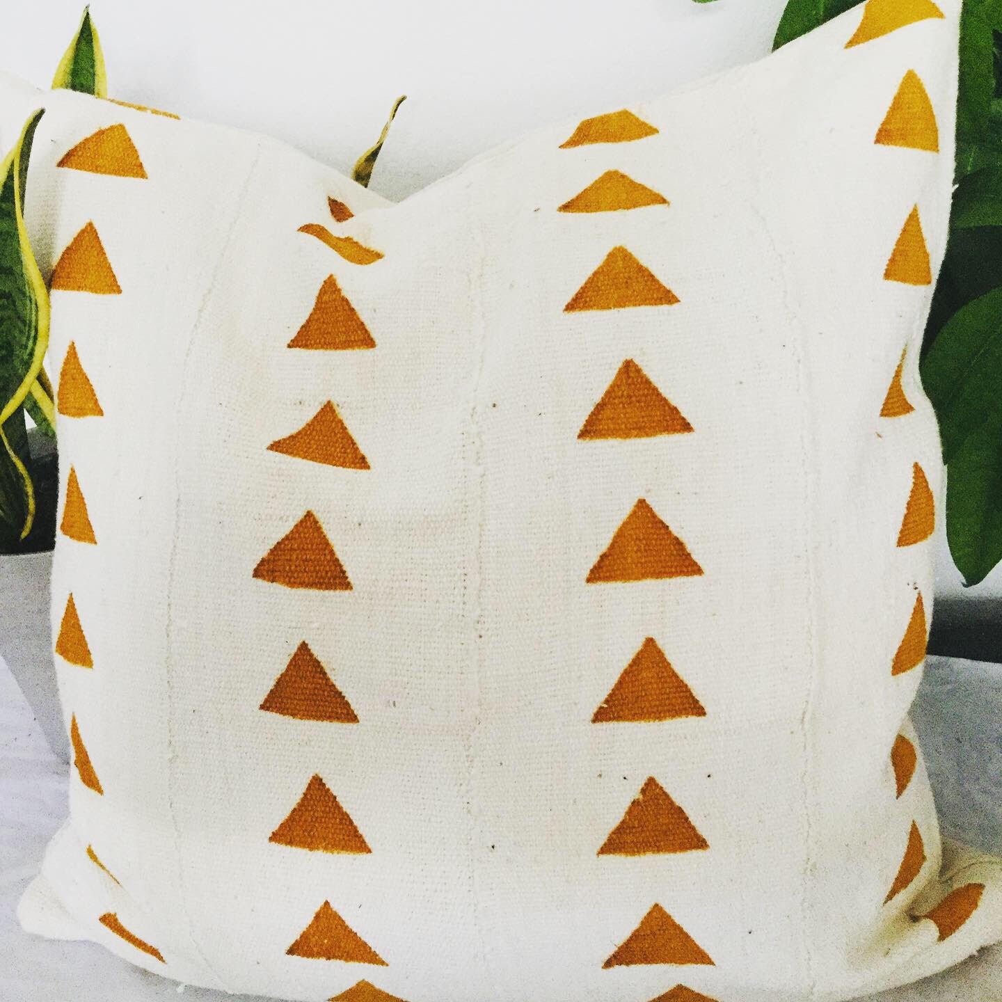 Rust Triangles on White Pillowcase