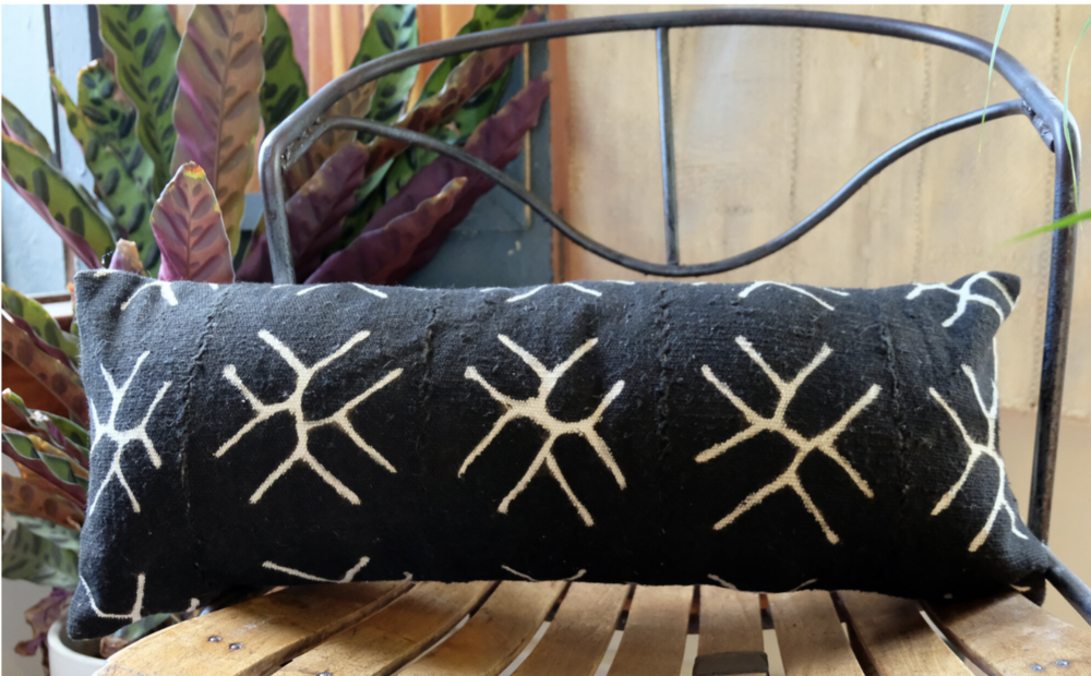 Snowflakes on Black Mali Mudcloth Lumbar Pillow.